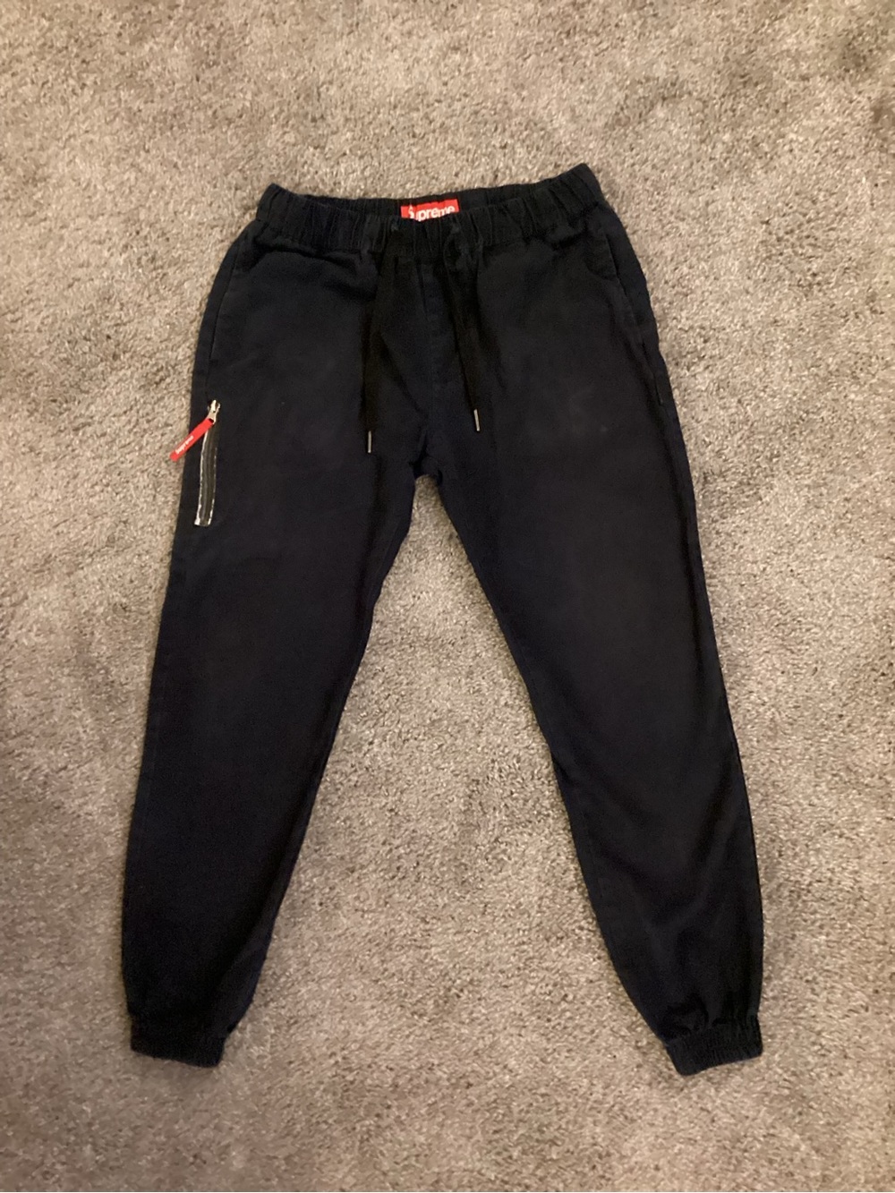 Supreme Black Cargo Jogger Pants with Red Zip Pull